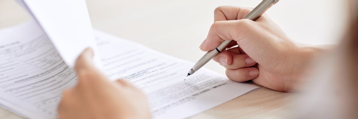 Crop person signing contract