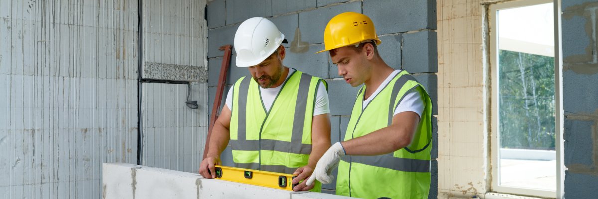 Construction Workers Building Wall