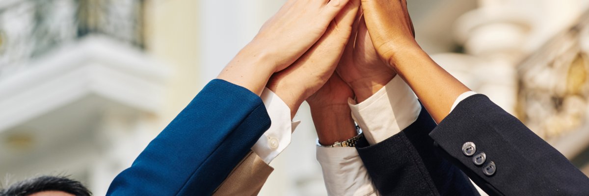 Business people giving high five Business people giving high five