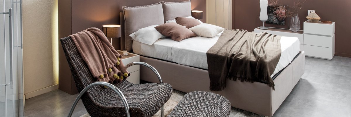 Modern luxury bedroom with recliner chair