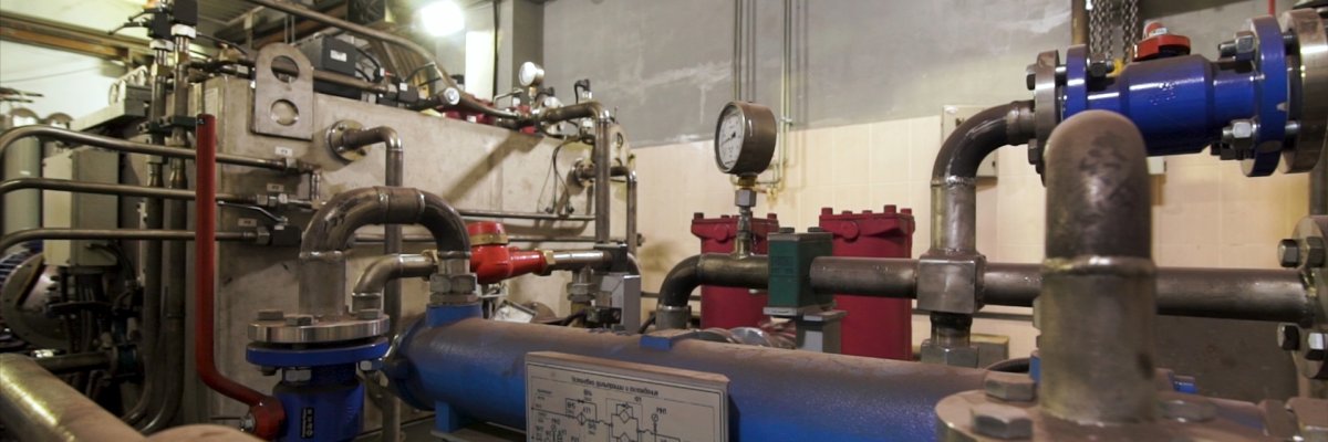 Large industrial boiler room, pipes of central heating system and water pipes with thermal insulation. Stock footage. Equipment at the power plant. Large industrial boiler room, pipes of central heating system and water pipes with thermal insulation. Stock footage. Equipment at the power plant.