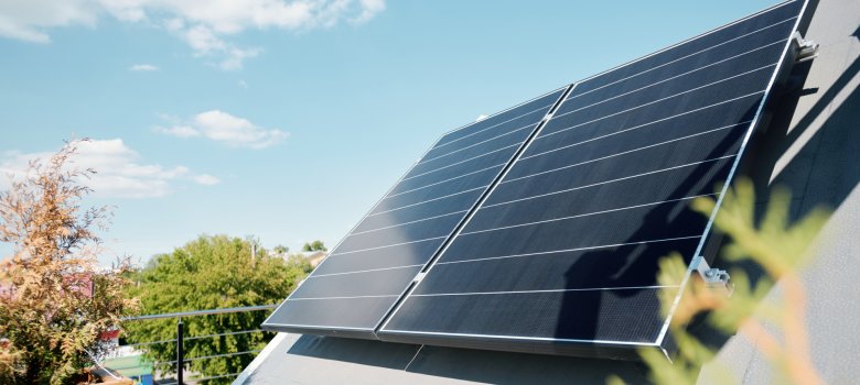 Large solar panels on rooftop of modern comfortable house or cottage Large solar panels on rooftop of modern comfortable house or cottage